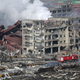 Crushed containers and burnt-out buildings.